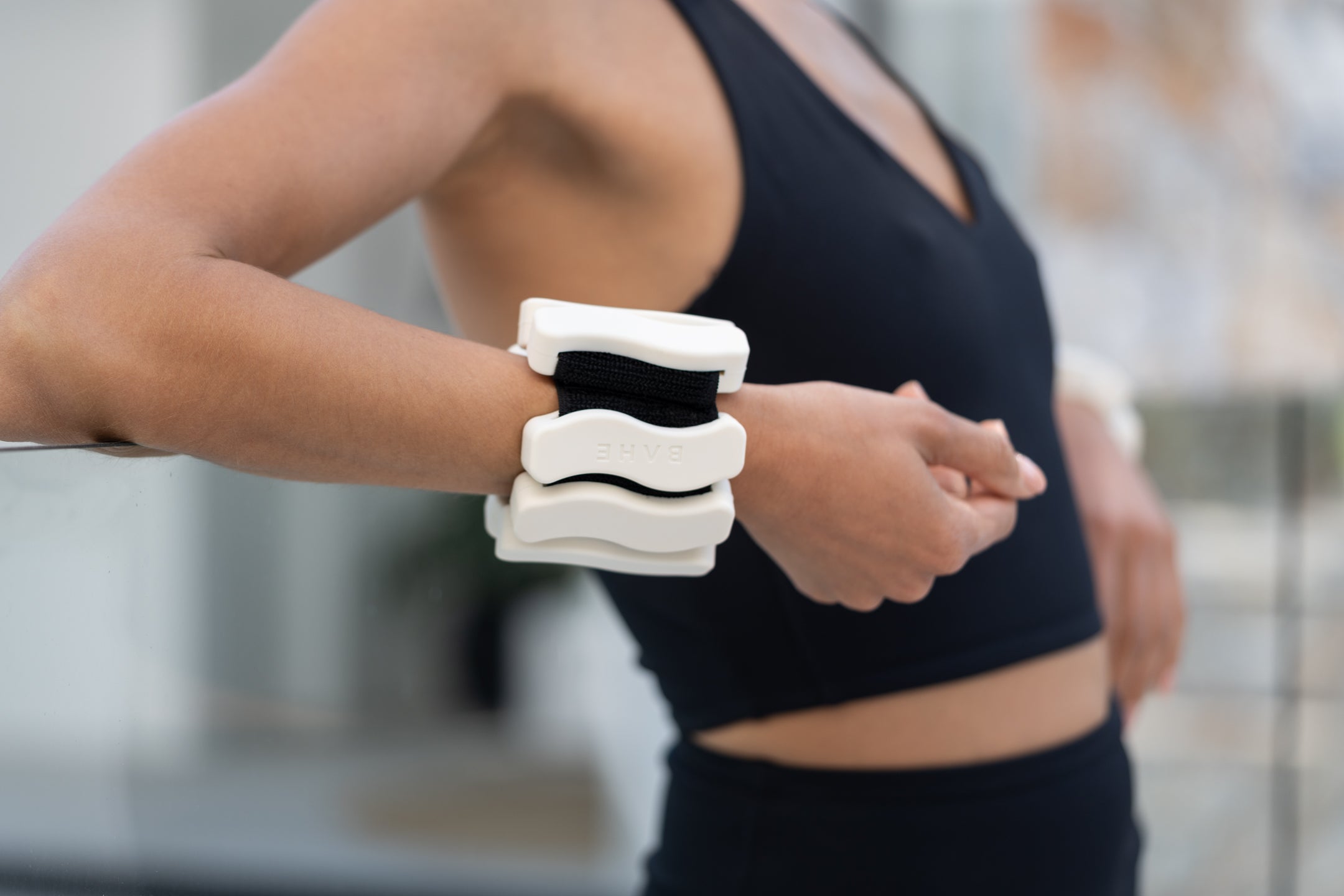 Sleek, sculptural wrist weights by BAHE — designed for mindful strength and seamless integration into everyday workouts